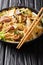 Stir-friedÂ PorkÂ AndÂ Cabbage Glass Noodles  close-up in a plate. Vertical